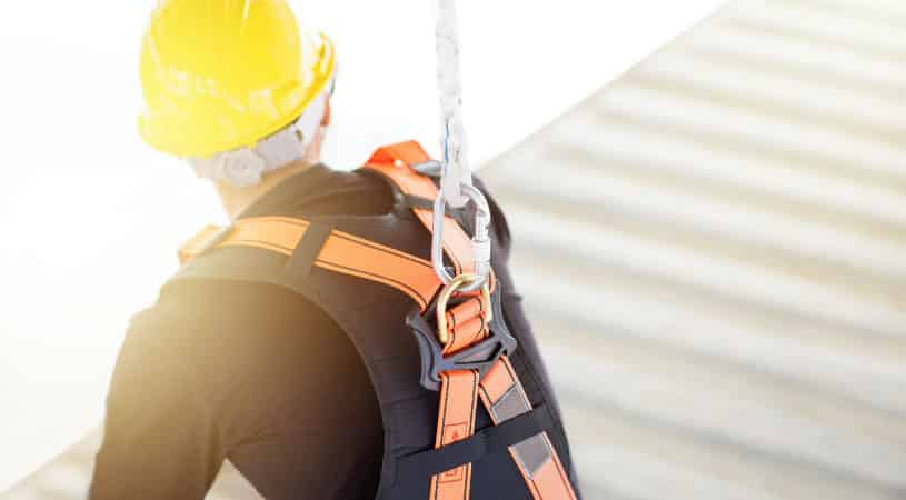 Construction worker tied in for safety