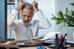 worker tearing hair out